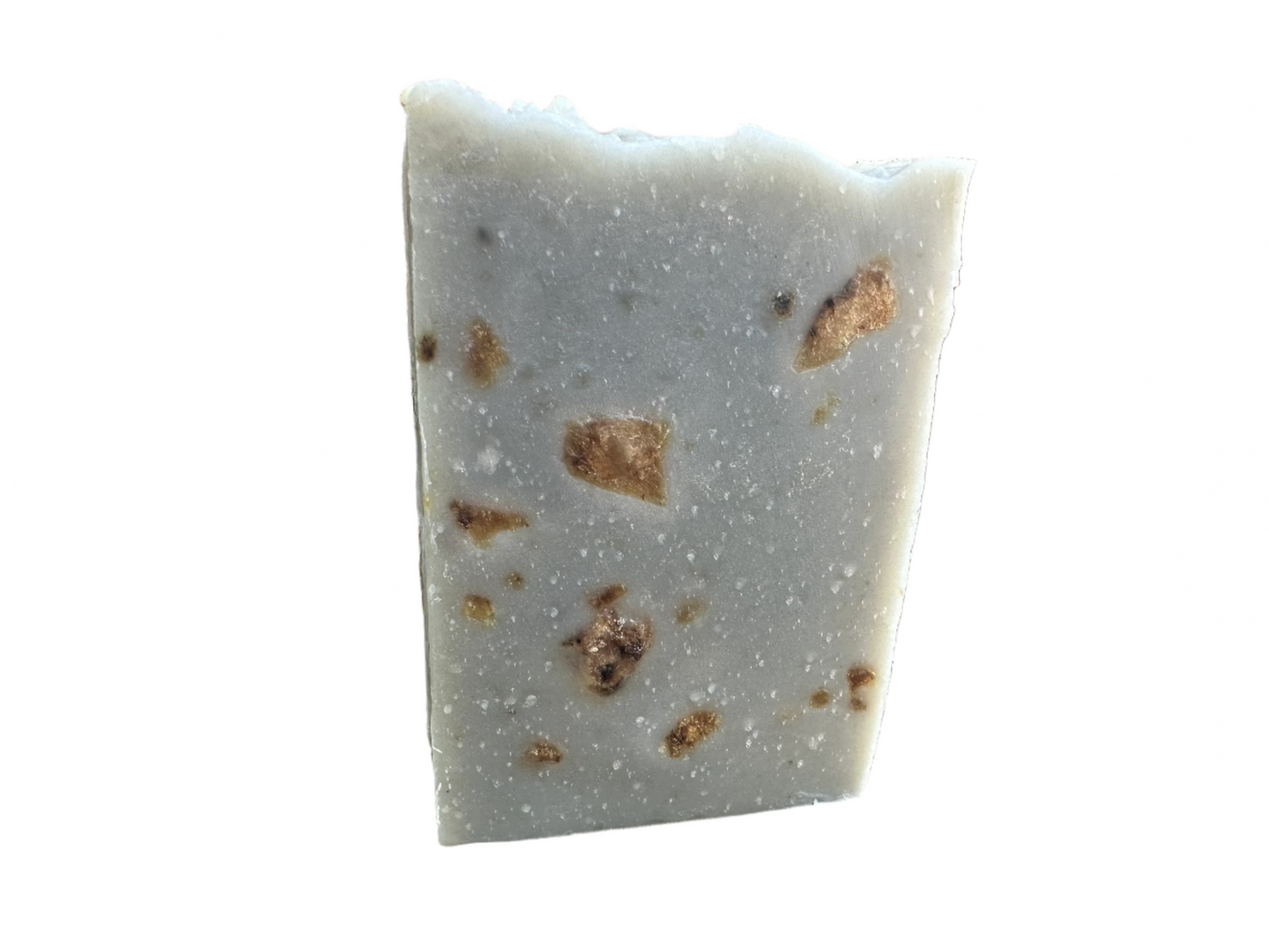 Light brown/gray bar with African Black soap crumbles embedded in it.