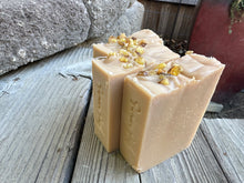 Beige soap bar with frankincense tears sprinkled on top