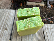 2 Light green soap bars with brighter green boarder, hemp seeds sprinkled on top