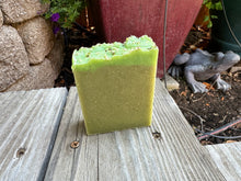 Light green soap bar with brighter green boarder, hemp seeds sprinkled on top
