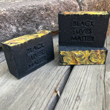 three black soap bars with writing "black lives matter"