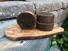 Round soap bar brown made with pine tar