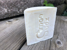 Off-white soap bar stamped with Simon Sudz on the front