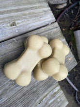 Beige dog bone shaped soap bars