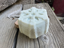 Light blue and off white round soap bars shaped like snowflakes ❄️ 