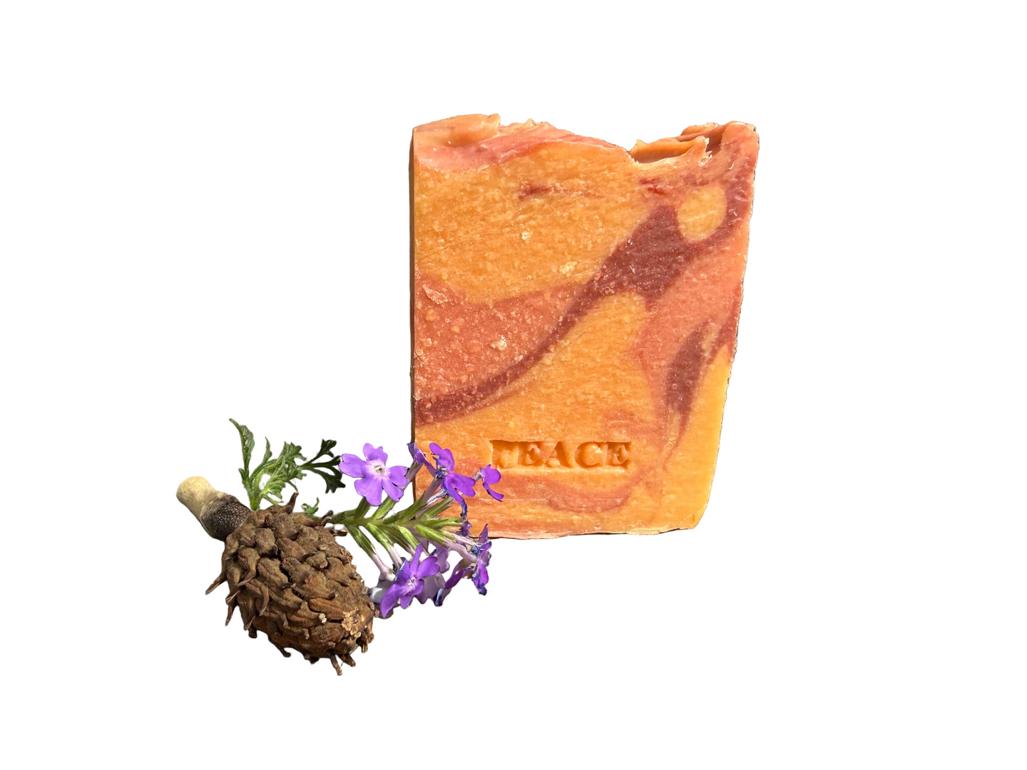 walk For Peace soap bar - orange swirls with the word PESCE stamped on the front