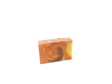 Orange, yellow and brown swirled soap bar with soap glitter on top 