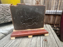 Rectangle soap bar brown made with pine tar stamped with Simon Sudz on front