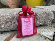 Purple brown soap bar in red organza bag